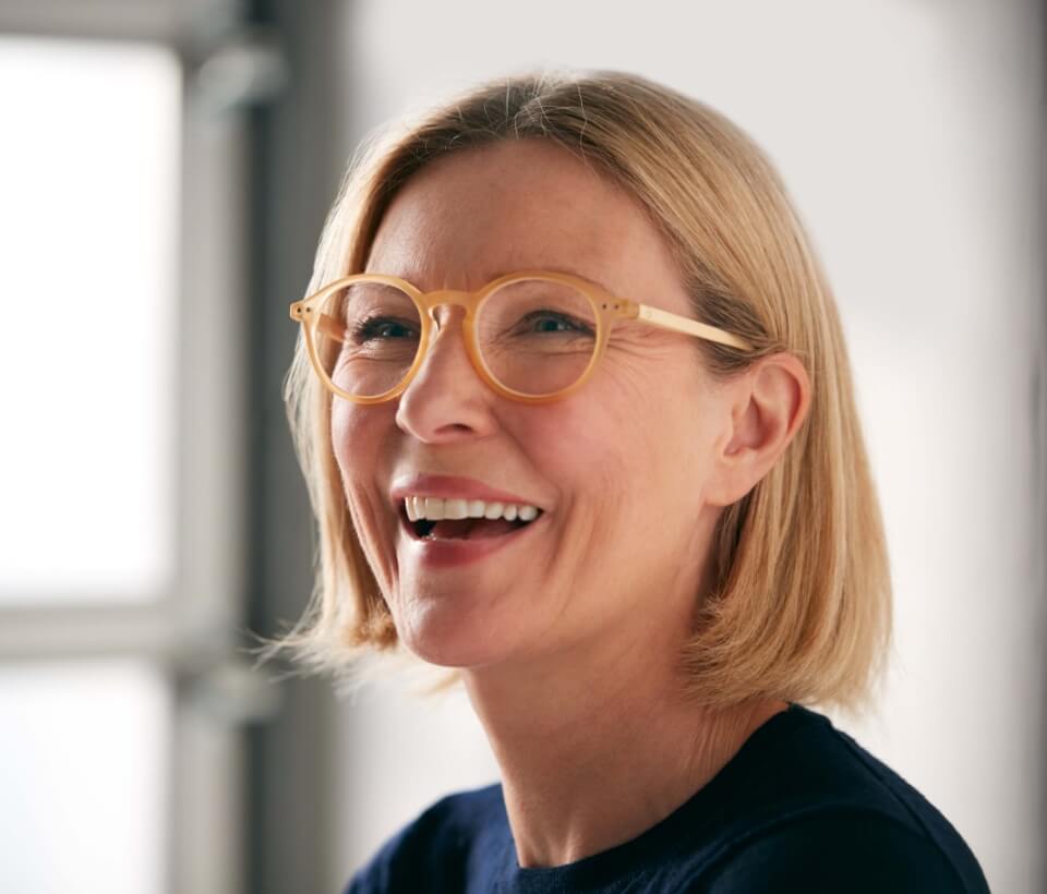 woman smiling after visiting the dentist in Oregon City, OR