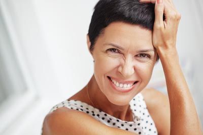 woman who just got dental implants from Beavercreek Dental smiling