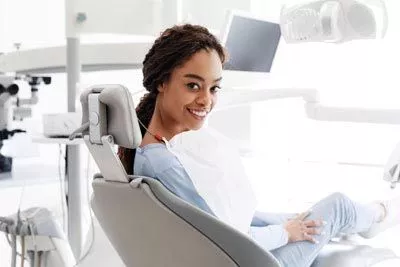 woman smiling after getting a dental procedure done at Beavercreek Dental